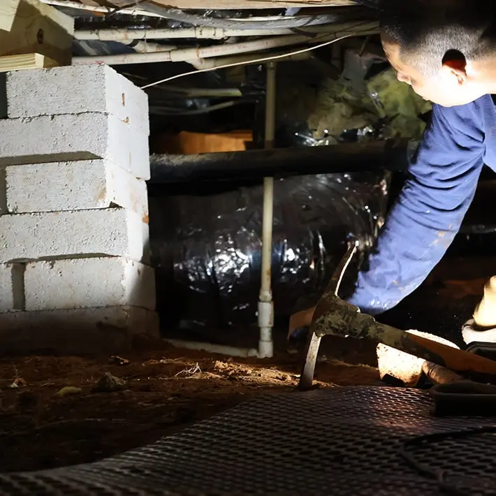Foundation Solutions Group expert inspecting crawl space in Rochester, KY.