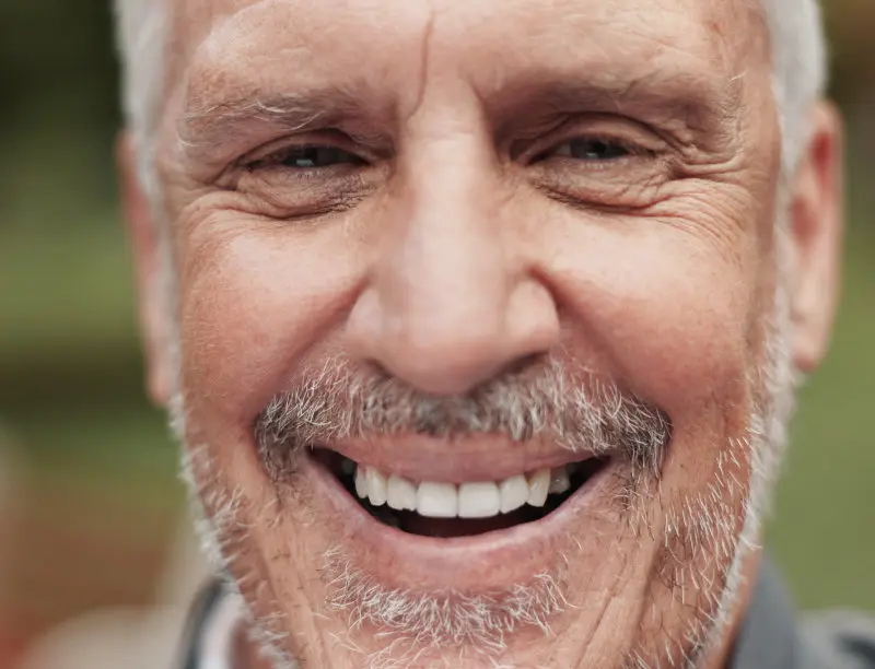 Senior man smiling confidently