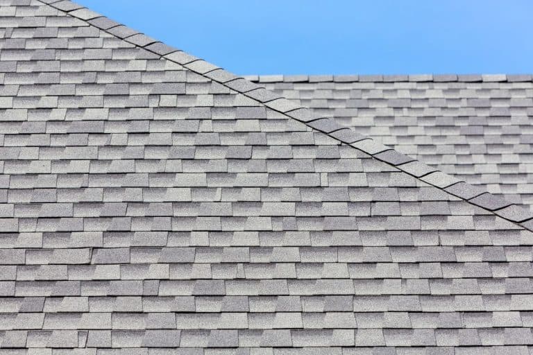 grey asphalt shingle roof with ridge cap shingles