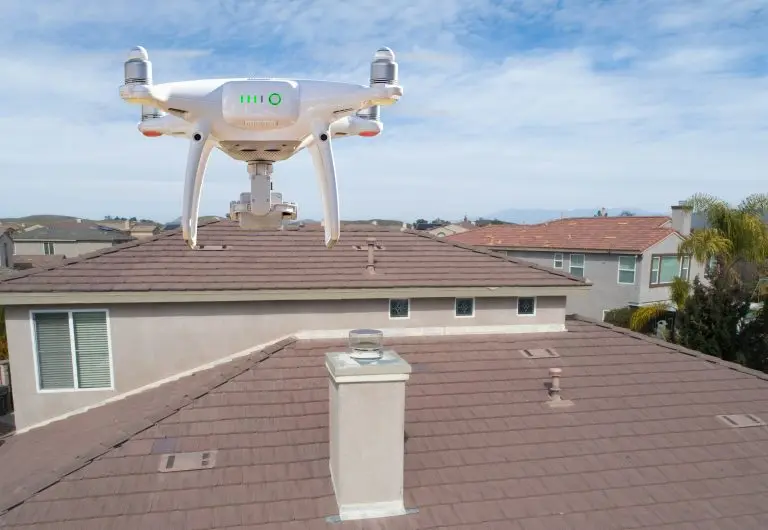Quadcopter UAV Drone Flying A Residential Roof Inspection.