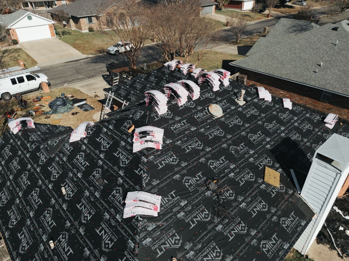 Roof replacement in progress by MINT Exteriors