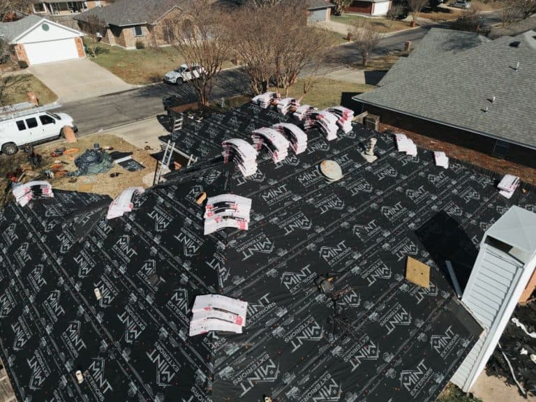 Roof replacement in progress by MINT Exteriors
