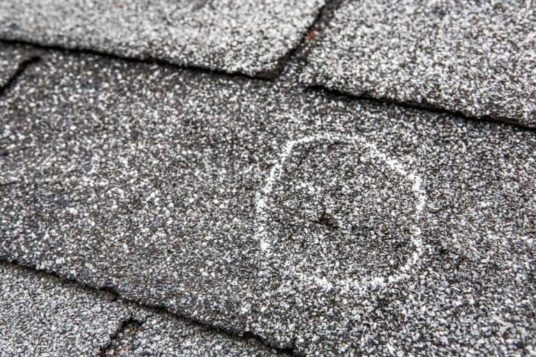 close-up view of shingle damage after hail storm