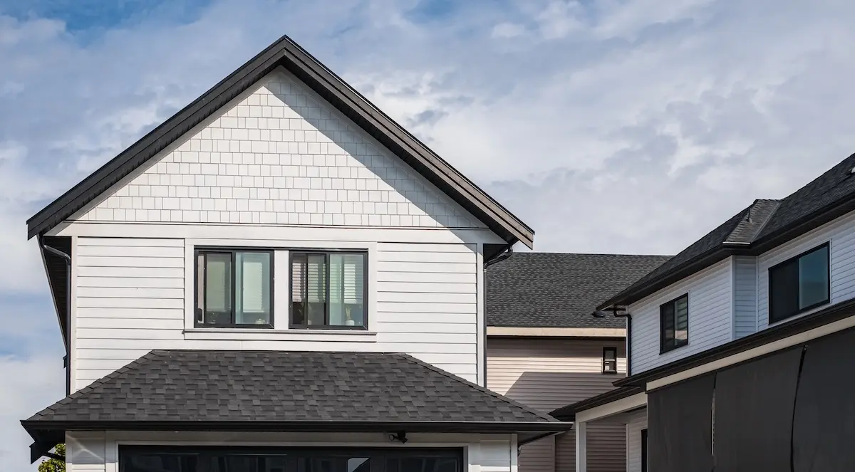 black roof with new white siding