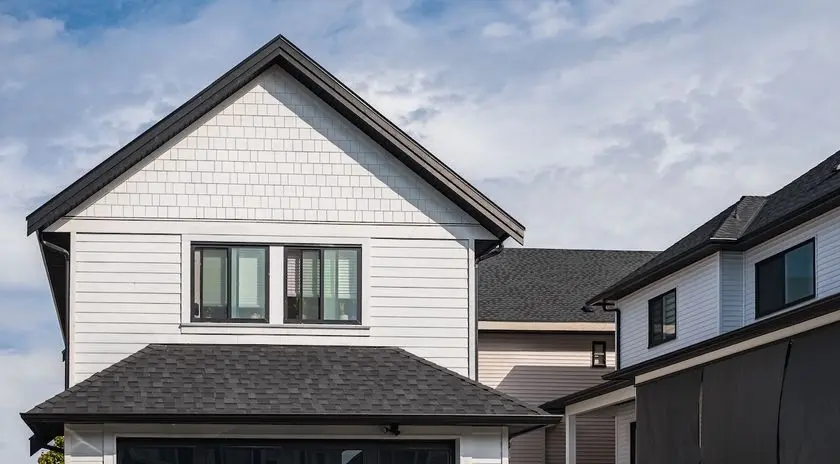 black roof with new white siding