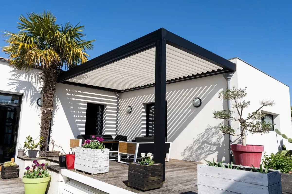 a patio with aluminum pergola