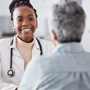 primary care doctor and patient talking about dementia