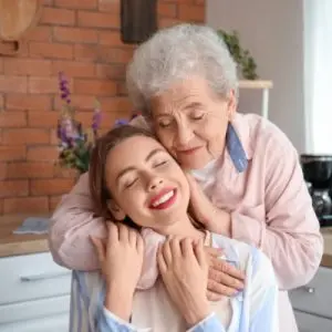 Mom hugging daughter co-agent power of attorney