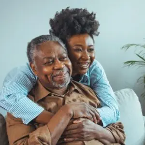caregiver hugging father
