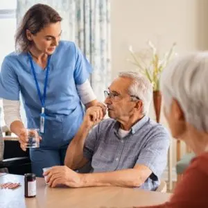 nurse giving antibiotics for infection