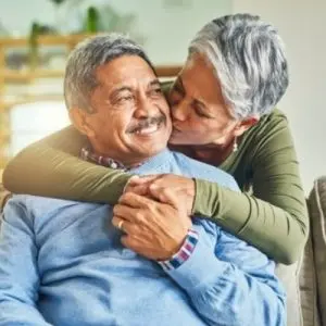 Wife Kissing Husband With Dementia