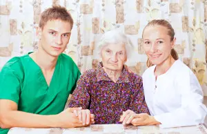 Older woman with caregivers Older woman with caregivers