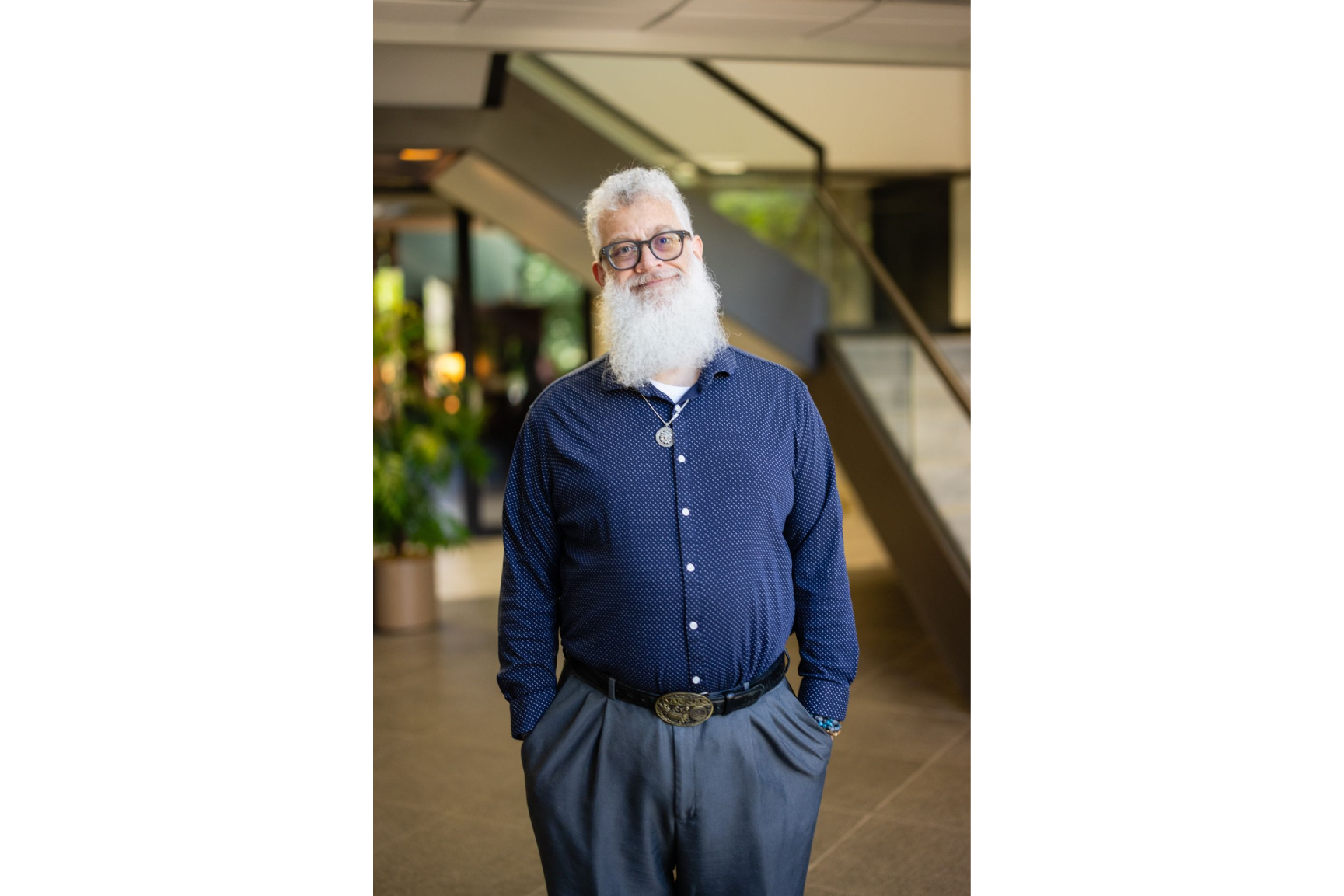 A man with long white beard and glasses