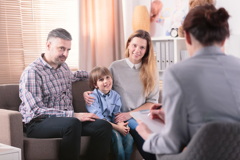 A therapist works to resolve issues with a family during family counseling