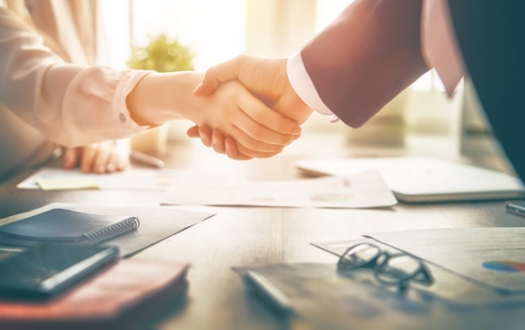 A handshake seals the mediation arrangement