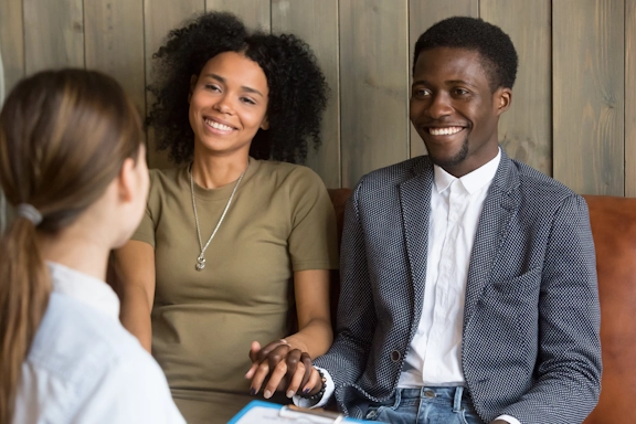 A happy couple participates in premarital counseling at Armstrong Family Counseling
