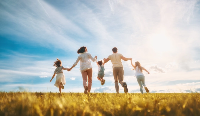 A family enjoys a beautiful sunny day together outdoors