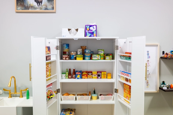 A play kitchen cupboard used as part of play therapy at Armstrong Family Counseling in Kansas City
