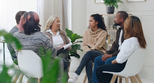 A group therapy session where participants share together