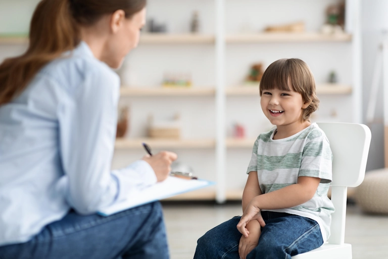 A child participates in psychological testing with a psychologist in Kansas City