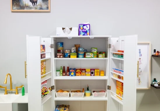 A play kitchen cupboard used as part of play therapy at Armstrong Family Counseling in Kansas City