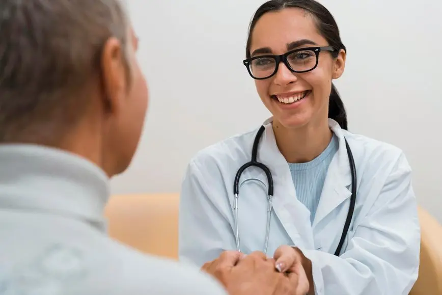 happy-doctor-talking-patient Augusta Acupuncture Clinic | Autoimmune Disorders