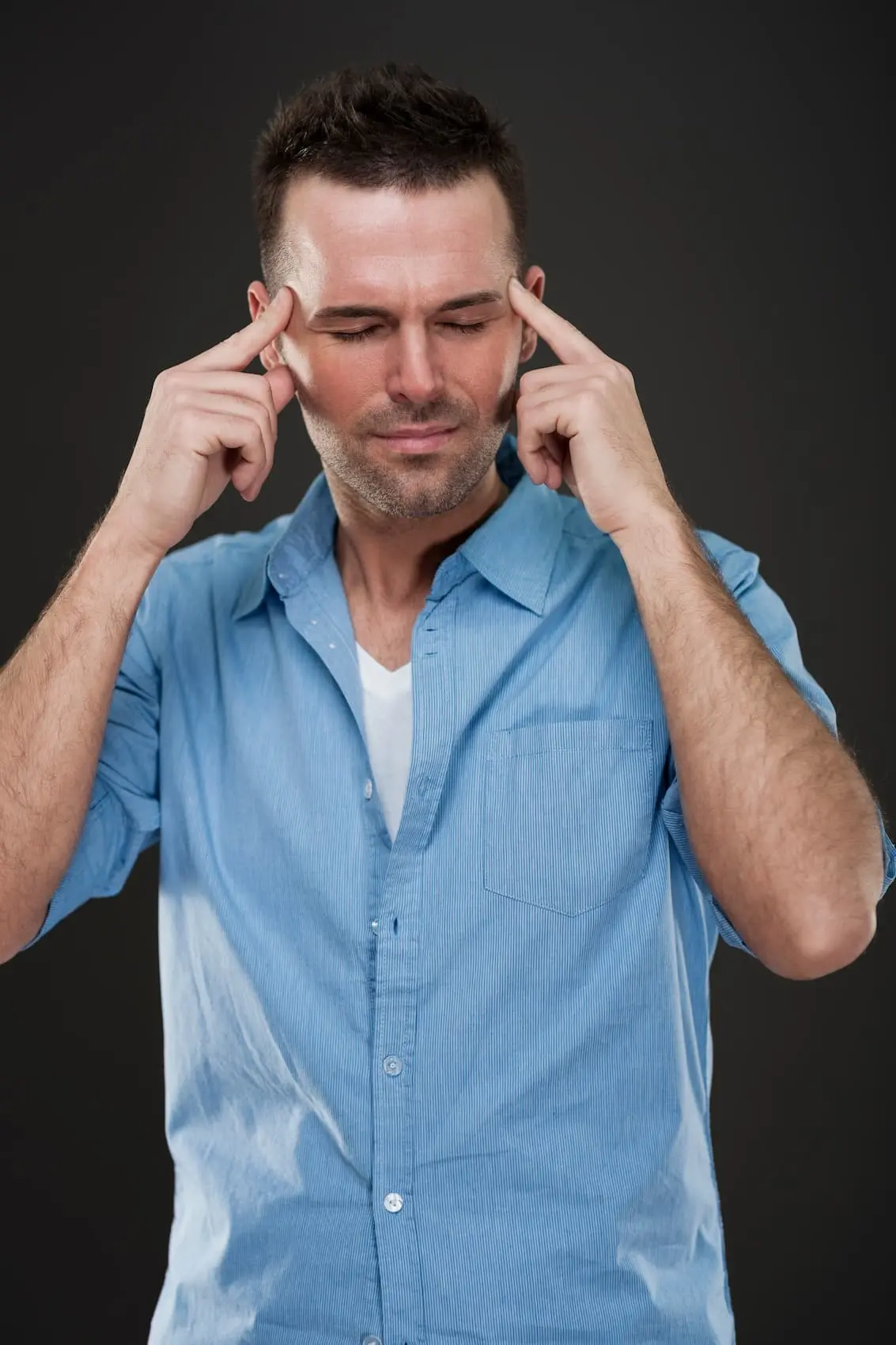 handsome-man-with-headache Augusta Acupuncture Clinic | Top TBI Acupuncture Specialist in Augusta