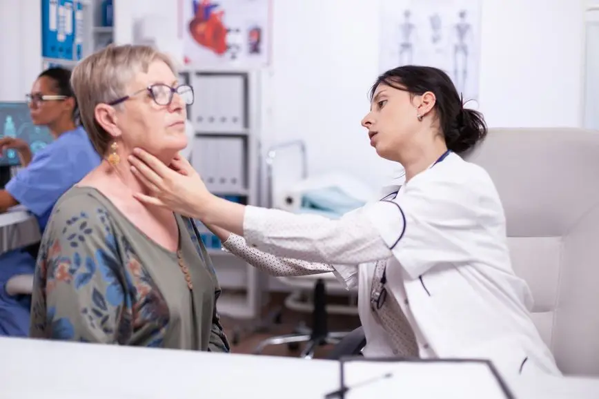 checking-thyroid-throat Augusta Acupuncture Clinic | Autoimmune Disorders