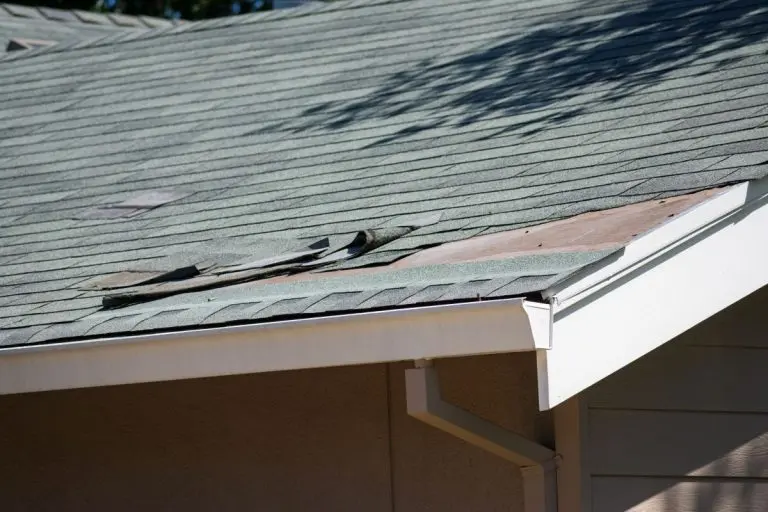 roof with missing and broken shingles, Wayzata