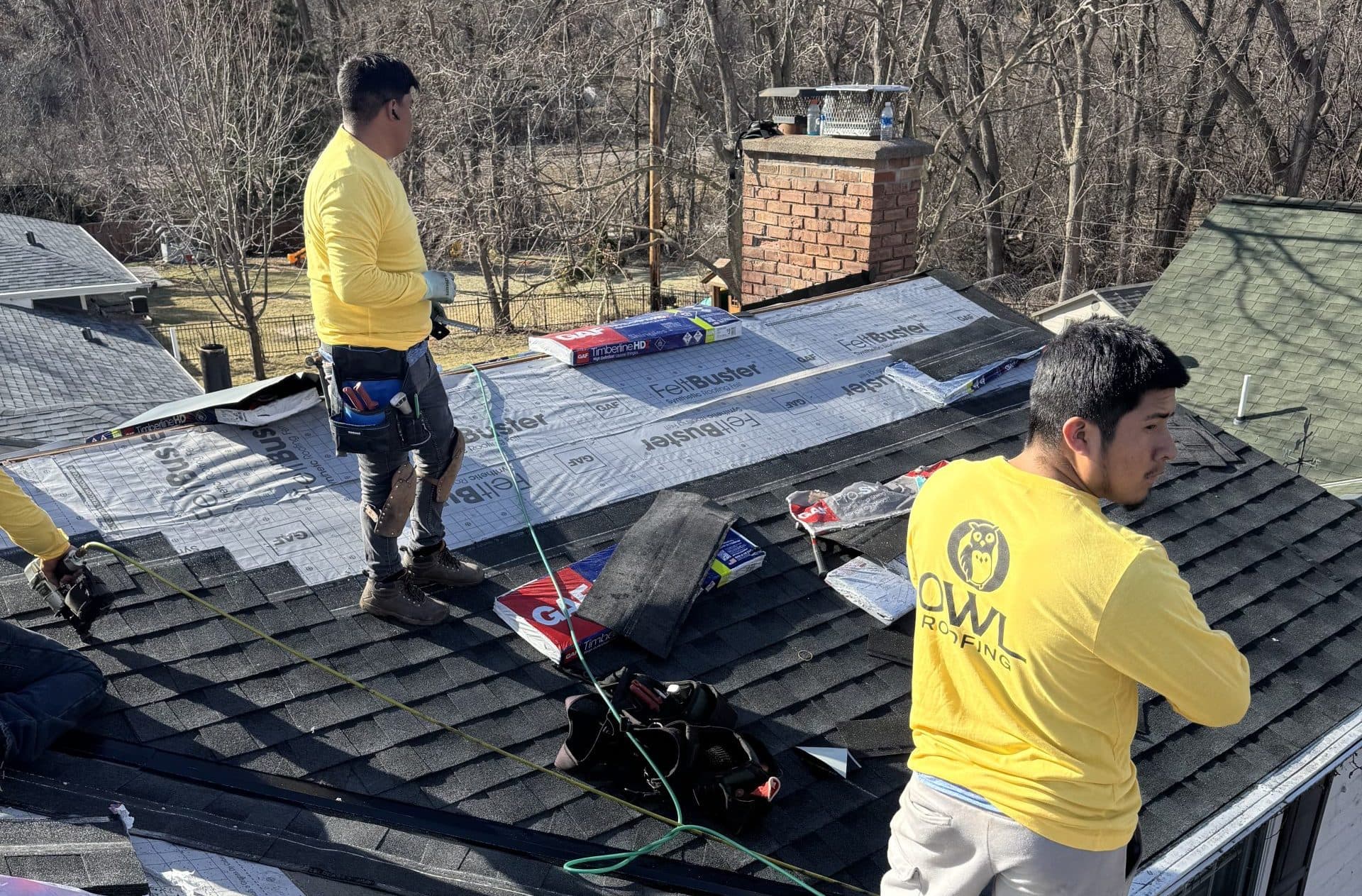 Owl Roofing working on a roof in Wayzata, MN
