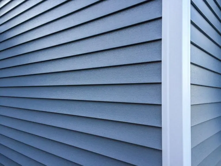 Blue vinyl siding with white trim on the outside wall of a new home, Wayzata, MN