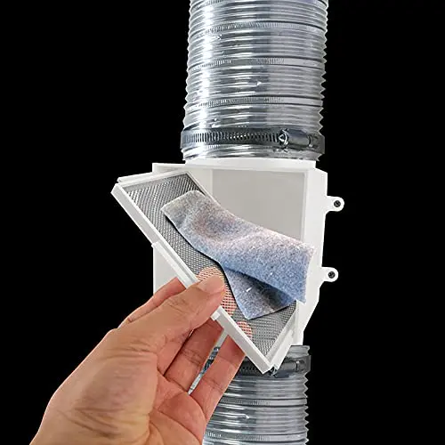Person cleaning lint from an inline dryer vent trap