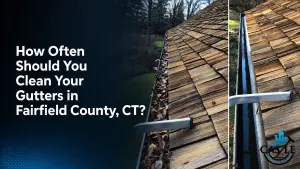 Before-and-after gutter cleaning on a cedar-shingle roof in Fairfield County, CT, showing a leaf-filled gutter beside a clean gutter.