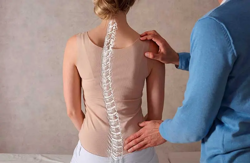 Spinal decompression therapy illustration showing vertebrae alignment and nerve relief.