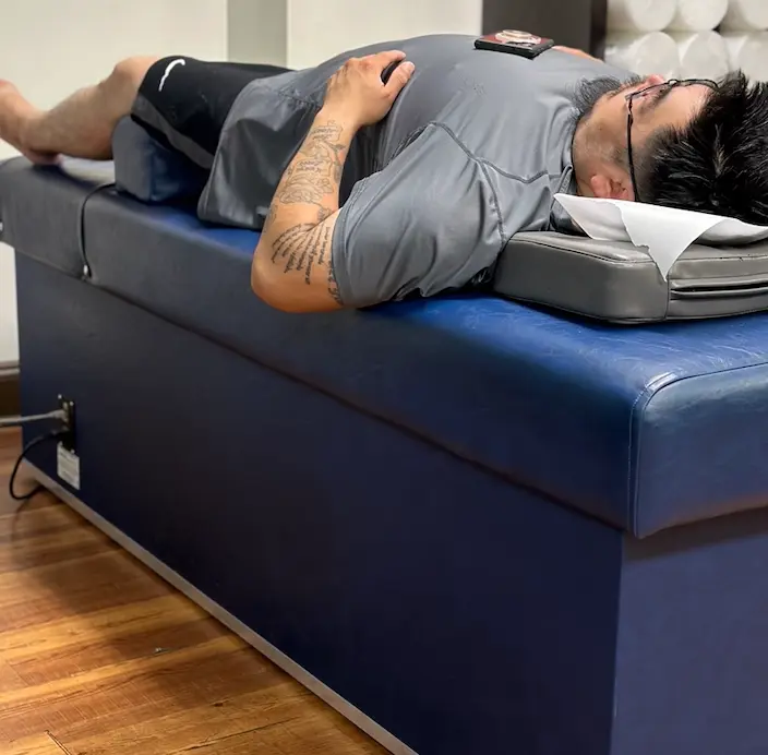 Chiropractic care treatment on table for pain relief and musculoskeletal health.
