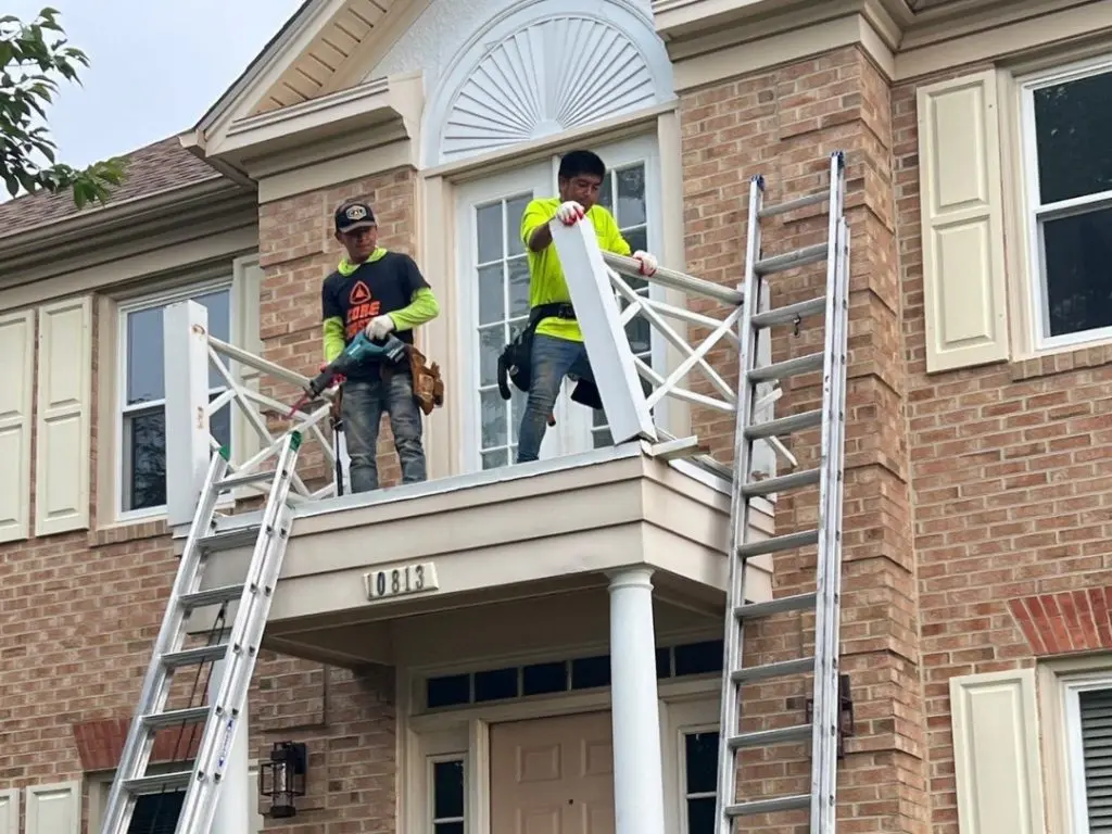 Workers repairing window does window insulation film work