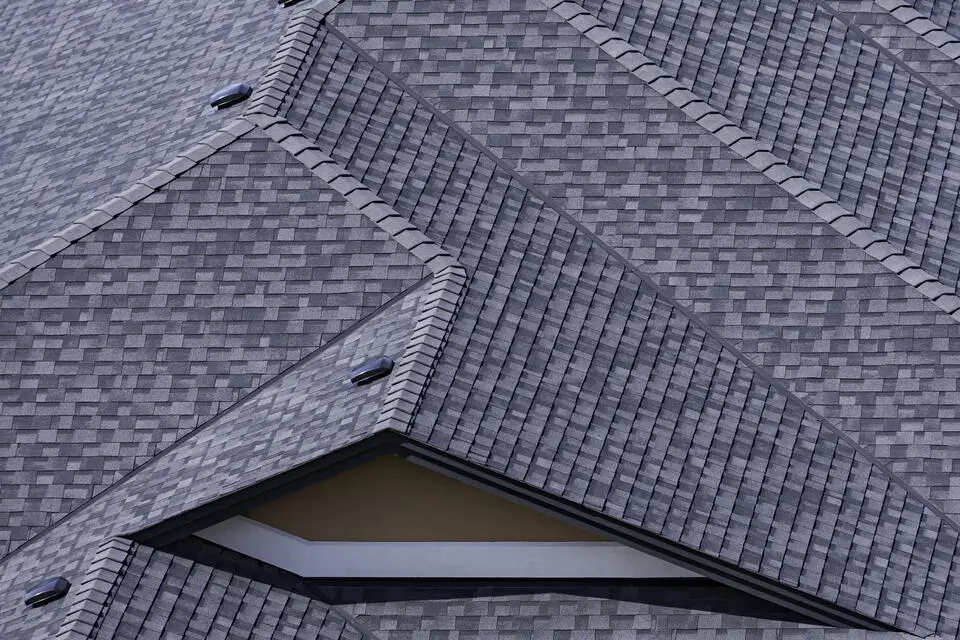 architectural shingles vs 3 tab-dark gray architectural shingles on a home