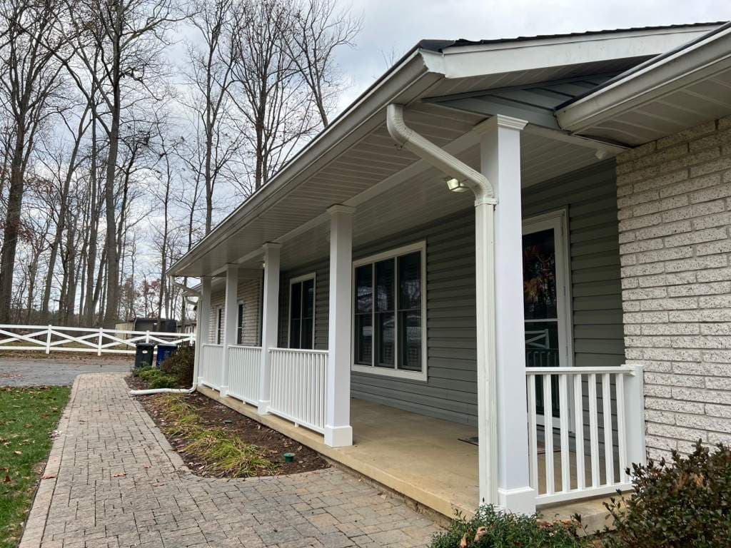 New siding and a covered porch on a home in Frederick, Maryland