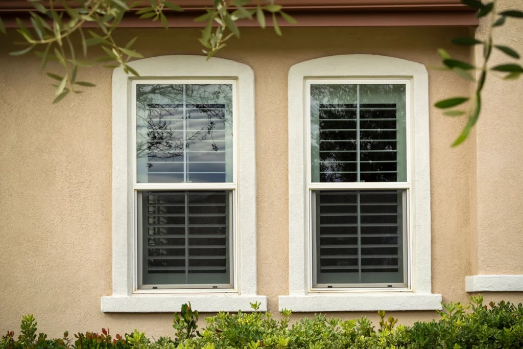 single hung standard size windows on stucco wall