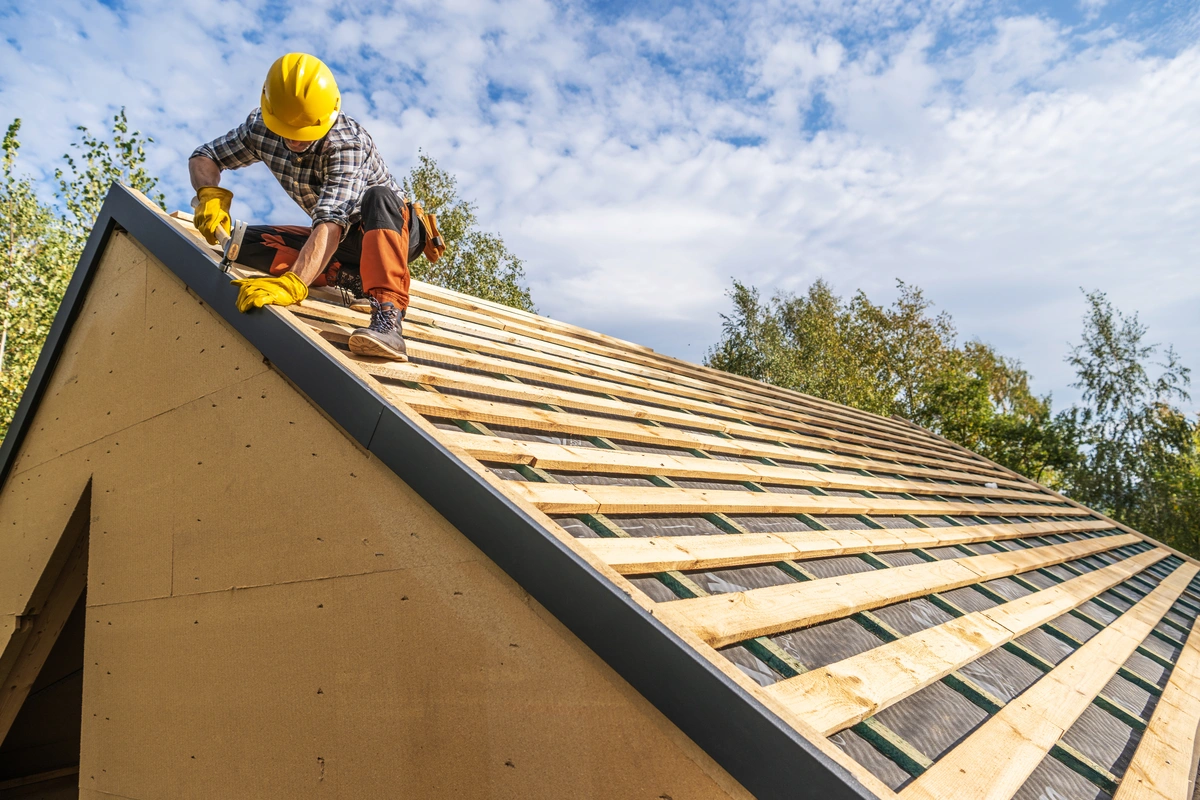 roof technician building out framing on a residential roof