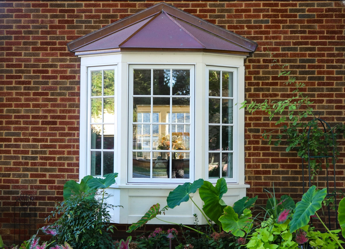 curved window on brick house