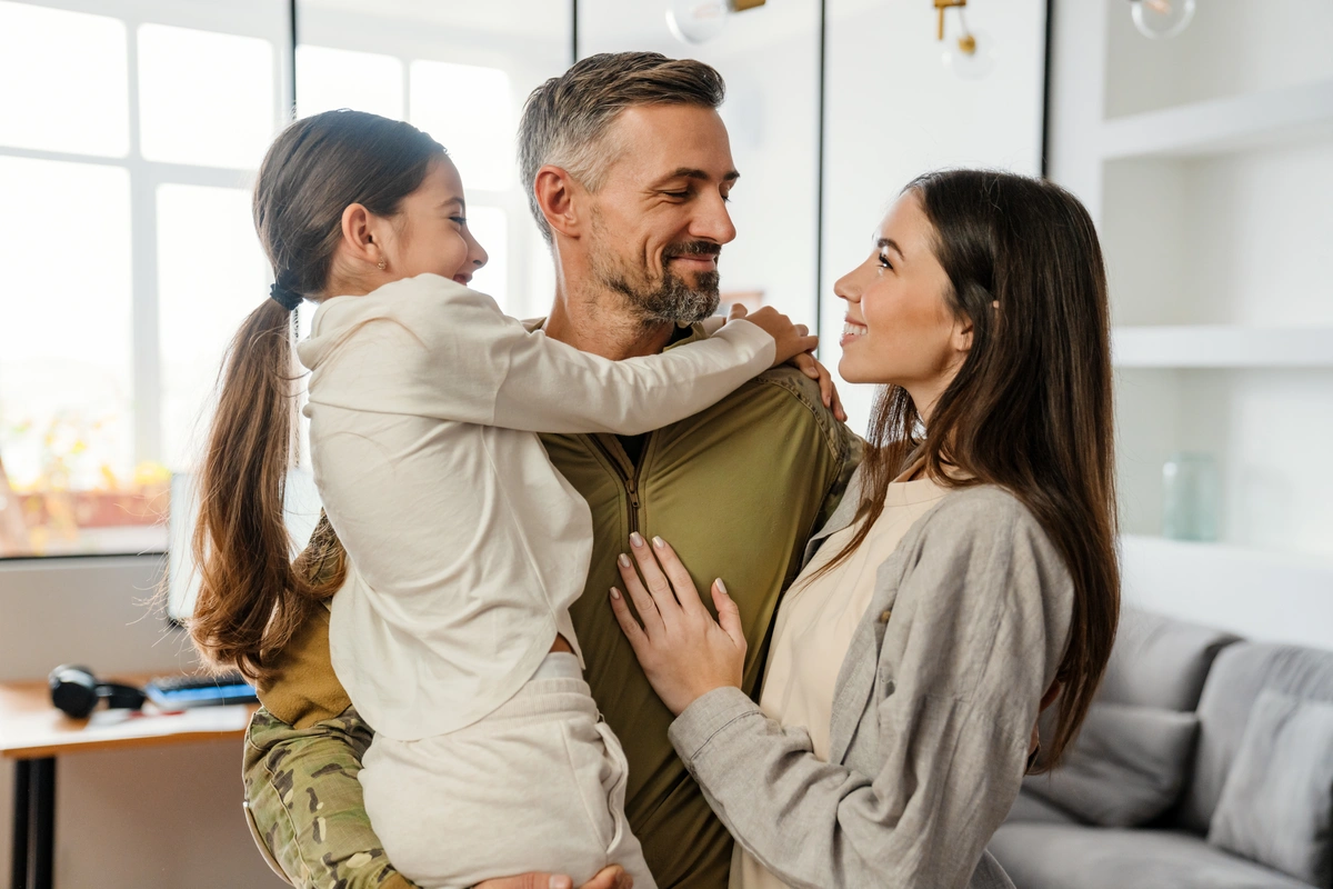 family of three hugging each other