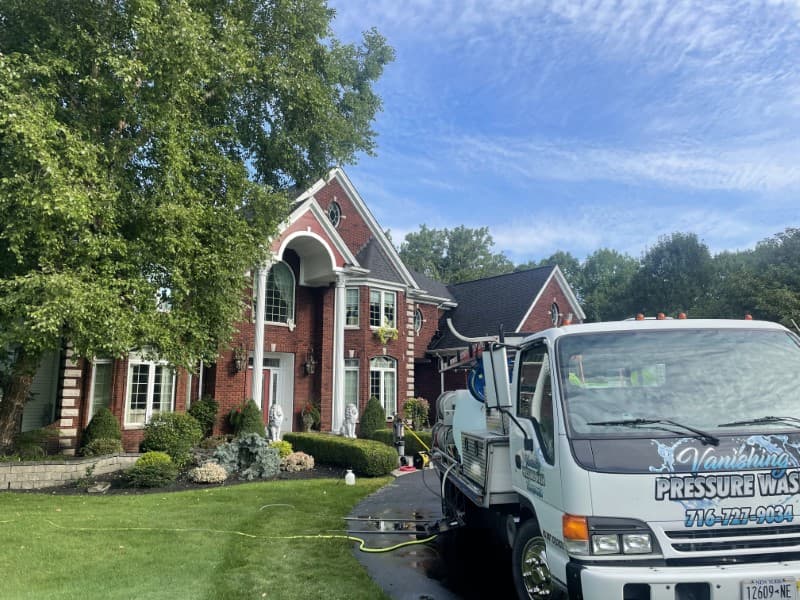 Exterior cleaning and window cleaning a house in Orchard Park, NY