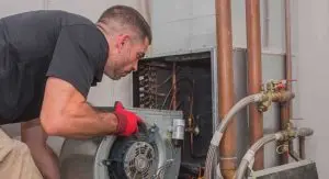 Technician servicing HVAC system