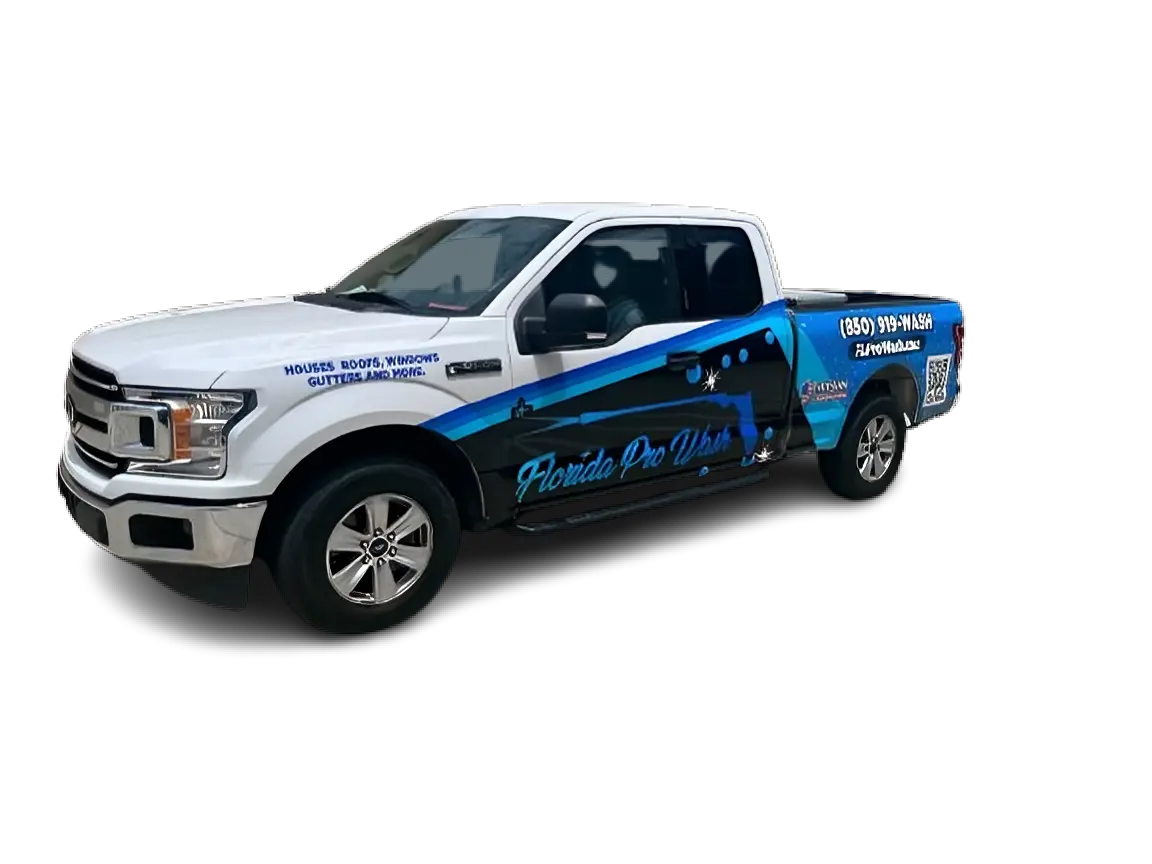 White Ford F-150 truck with a custom wrap advertising "Florida Pro Wash". The wrap features blue graphics, a pressure washer illustration, and contact information. Text on the truck reads "Houses, Roofs, Windows, Gutters and More.