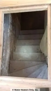 A scary stair way to see the water heater