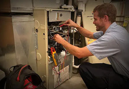 technician repairing heater
