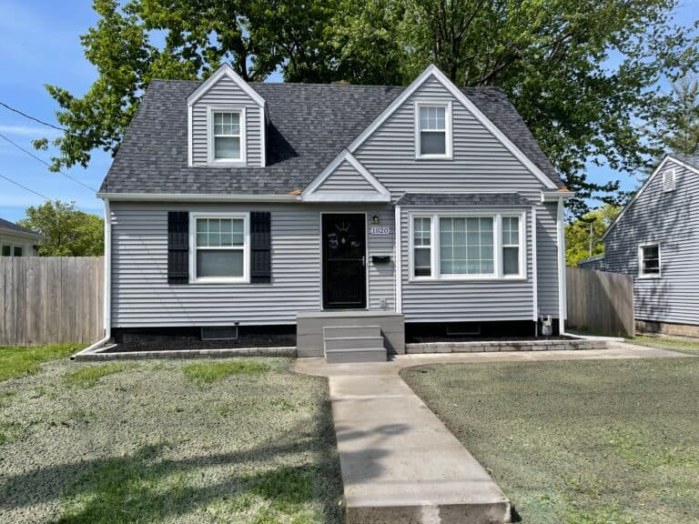 gray siding new shingles roof Jansen project