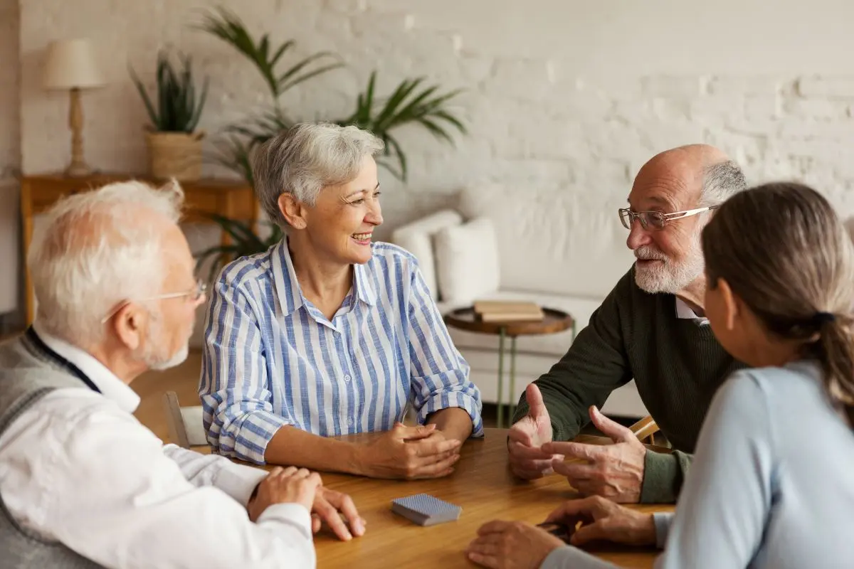older people reunited to play cards