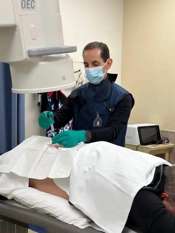 Dr. Jared Greenberg performing an injection at NeuroSpine Center of Wisconsin